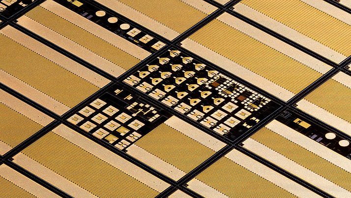 The image shows a detailed view of gallium nitride Schottky diodes on a wafer.