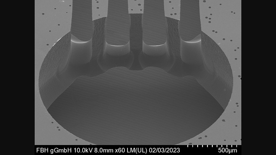 Tilted image of a round shaped opening through a 1 mm Si wafer. 