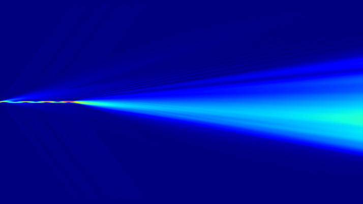 Abstract picture with a deep blue background on which a bright ray of light radiates in soft blue tones from the center to the far right.