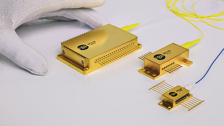 three fiber-coupled diode laser modules next to each other