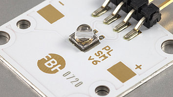 UV LED with lens mounted on a printed circuit board