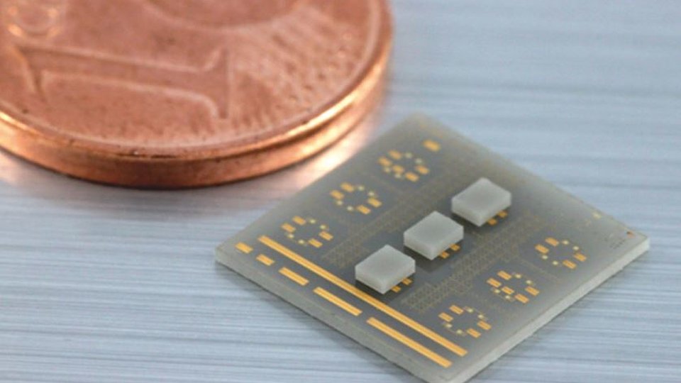 Three passive mm-wave test chips mounted on carrier substrate