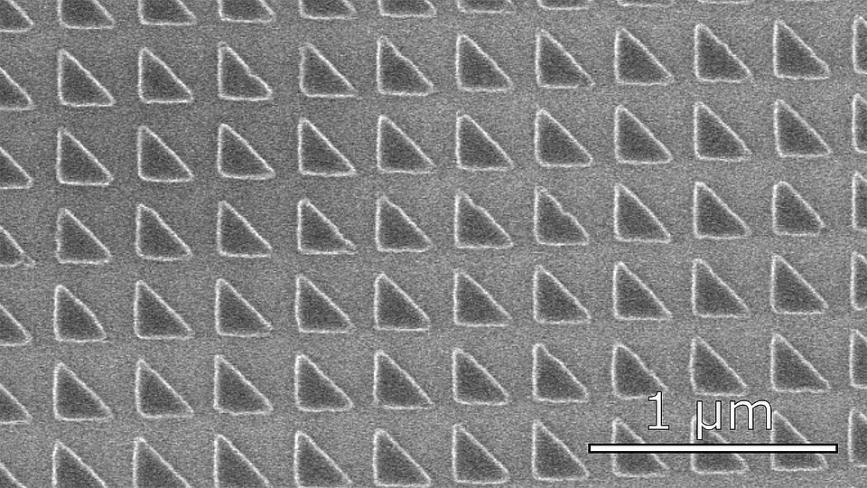 Scanning electron microscope image during the processing of a nanoscale photonic crystal array