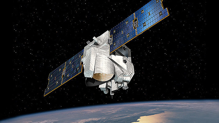Der Klimasatellit MERLIN im Weltall. Im Hintergrund ist ein Teil der Erde zu sehen.