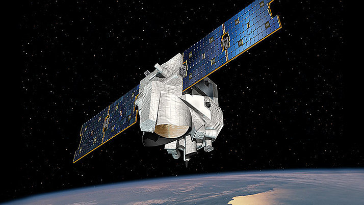 The MERLIN climate satellite in space. Part of the Earth is visible in the background.