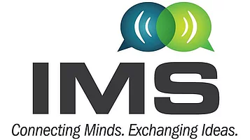 Logo von IMS. "IMS" ist in großen, kräftigen Buchstaben dargestellt. Darüber befinden sich zwei Sprechblasen in verschiedenen Farben. Darunter steht der Slogan "Connecting Minds. Exchanging Ideas."