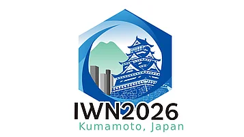 Logo for IWN 2026 featuring a stylized depiction of Kumamoto Castle within a hexagonal shape, with mountains and water elements in blue. Text below reads "IWN2026" and "Kumamoto, Japan.