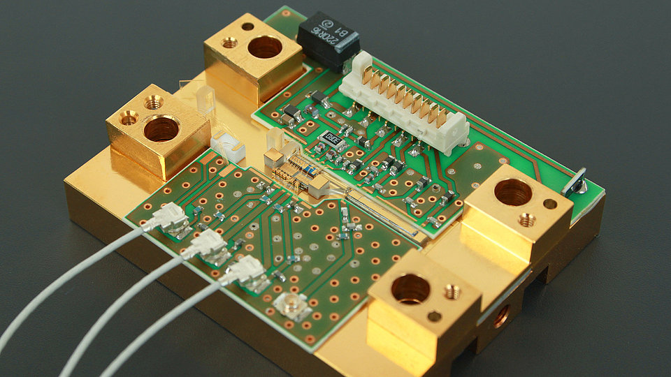Microbench for integrated pulse-laser system including optical and electronic components