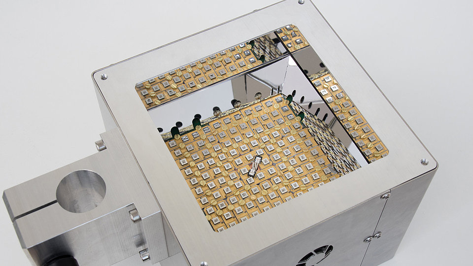 Cube-shaped remote UVC irradiation system for eliminating microorganisms