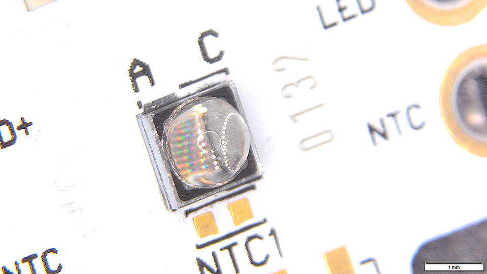 UV LED planar AlN submount with NGK elliptical quartz lens on PCB