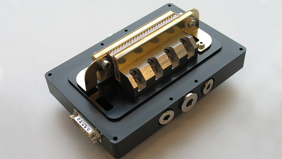 Fig. 1: Fully assembled, vertical fast axis collimated (FAC) and application-ready 1.4 kW class stack module. 