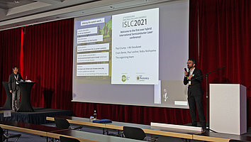 General Chair Paul Crump (right) and Program Chair Akihiko Kasukawa (left) welcome participants to the 1st hybrid ISLC2021 conference in Potsdam.