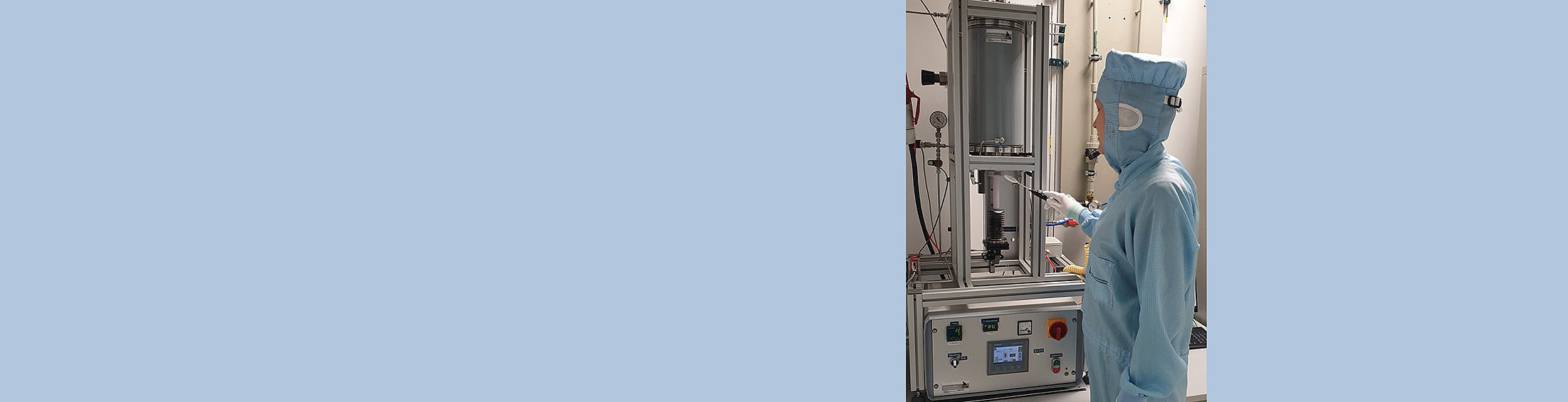 Person in front of oven for high-temperature annealing located in FBH’s epitaxy cleanroom.
